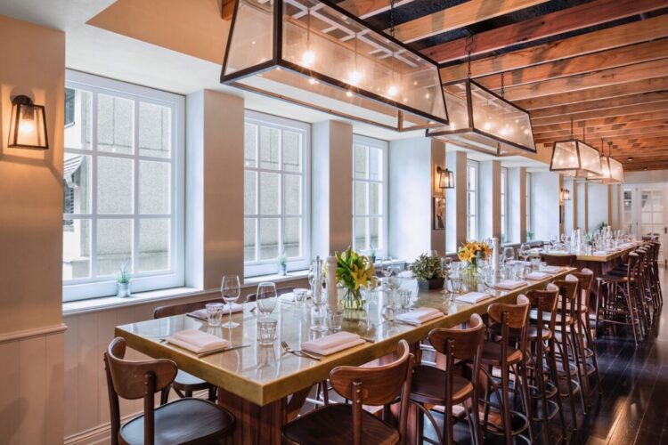 Le Petit Flot restaurant at Rydges Australia Square with tables set with flowers
