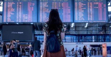 Woman in front of airline board, image Jan Vasek