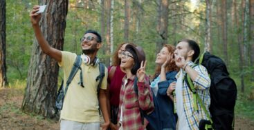 Friends taking group photo in the forest, image Vitaly Gariev